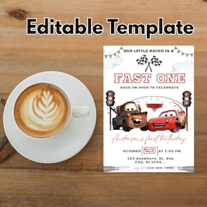 May include: A white coffee cup with latte art sits on a white saucer next to a birthday invitation. The invitation features the text "FAST ONE" with cartoon cars and the words "Anderson's first birthday".