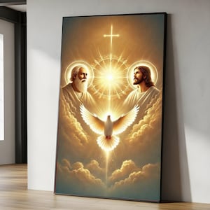 May include: A framed religious artwork depicting a radiant scene. The image features two figures, a dove, and a cross, all bathed in golden light. The figures are surrounded by clouds, creating a heavenly atmosphere. The artwork is displayed against a white wall.