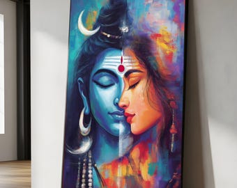 May include: A framed artwork depicting a split portrait of two figures. One side is a blue-toned male figure with a crescent moon and jewelry. The other side is a female figure with warm tones. The artwork has a black frame and is leaning against a wall.