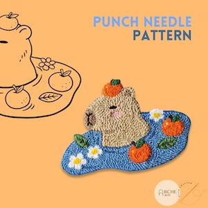 May include: A punch needle pattern featuring a beige bear with an orange hat and blush cheeks, sitting on a blue base with orange fruit and white flowers. The text "PUNCH NEEDLE PATTERN" is displayed in blue.