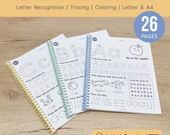 May include: Alphabet tracing worksheets with letter recognition, tracing, and coloring activities. The spiral-bound books feature uppercase and lowercase letters, with 26 pages. Includes illustrations of an apple, alligator, and airplane.