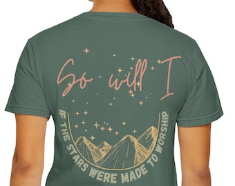 May include: A green t-shirt with the text "So will I" in a cursive font, above a mountain and star design. The shirt also has the text "If the stars were made to worship" in a circular design.