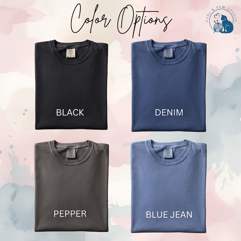 May include: Image showcasing four t-shirt color options: black, denim, pepper, and blue jean. Each shirt is displayed with its respective color name underneath. The text "Color Options" is written in cursive at the top of the image.