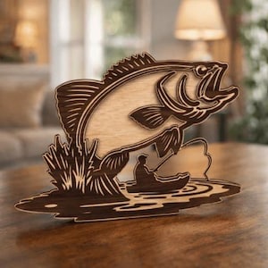 May include: Wooden decorative piece depicting a leaping bass fish above a fisherman in a boat. The fish and fisherman are in a dark brown colour, with a lighter wood colour for the fish's body. The piece is designed to stand on a flat surface.