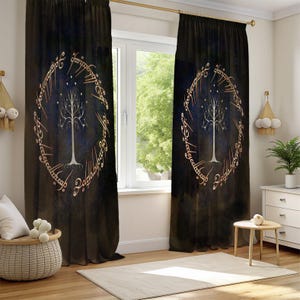 May include: Dark window curtains with a white tree design inside a gold circular frame with text. The curtains hang in front of a window, with a view of trees and greenery outside.