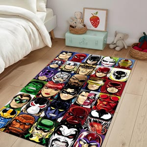 May include: A rectangular rug with a collage of comic book superhero faces. The rug has a purple background and features colourful character portraits, including Spider-Man, Batman, and the Hulk. The rug is placed on a light-coloured wooden floor.