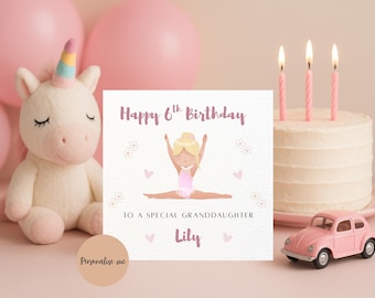 May include: A birthday card with a gymnast illustration, a unicorn plush, a pink toy car, and a cake with candles. The card reads "Happy 6th Birthday" and "To a special granddaughter Lily."