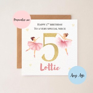 May include: A birthday card with a brown envelope. The card features two ballerinas in pink tutus, the number 5 in gold glitter, and the name "Lottie" in pink. Text reads "Happy 5th Birthday to a very special niece."