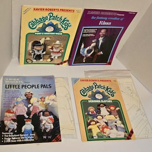 May include: Four Xavier Roberts Cabbage Patch Kids sewing pattern booklets with illustrated covers showing dolls in various outfits, including Pony & Western Wear, The Fantasy Creation of Rissa, Little People Pals, and Designer Clothes with paper patterns.