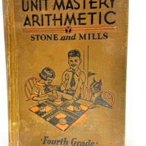 May include: Vintage "Unit Mastery Arithmetic" fourth grade textbook. The cover is tan with black and orange text and illustrations. The book's cover features a checkerboard game with children playing. The book is slightly worn.