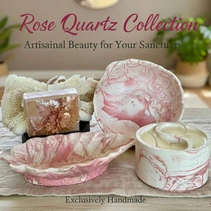 May include: A collection of handmade rose quartz items, including a soap bar, a decorative bowl, a small dish, and a round container. The items have a pink and white marbled design. The text "Rose Quartz Collection" and "Exclusively Handmade" are visible.