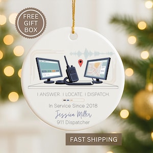 May include: White ceramic Christmas ornament with a gold string, featuring a 911 dispatcher design. It includes two computer monitors, a radio, and the text "I ANSWER. I LOCATE. I DISPATCH." Also includes the name "Jessica Miller" and "911 Dispatcher."