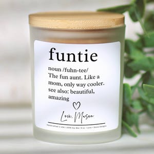 May include: A frosted glass candle with a wooden lid. The label reads "funtie" with a definition and the words "Love, Mason". The candle is 8 oz and made with soy wax.