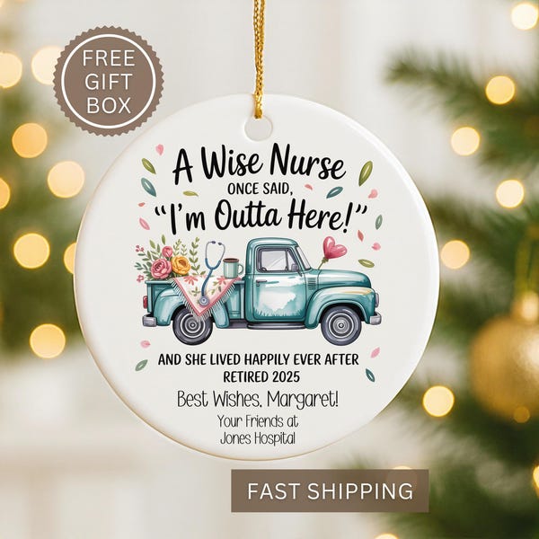 May include: A round white ceramic Christmas ornament with a gold hanging string. It features a teal truck with a stethoscope and flowers, and the text "A Wise Nurse Once Said, 'I'm Outta Here!'" and "Retired 2025".