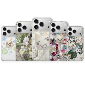 May include: Five clear phone cases with various cartoon cat designs. The cases feature white, green, and pink backgrounds with images of cats, stars, and other graphics. The cases are designed to fit a smartphone.