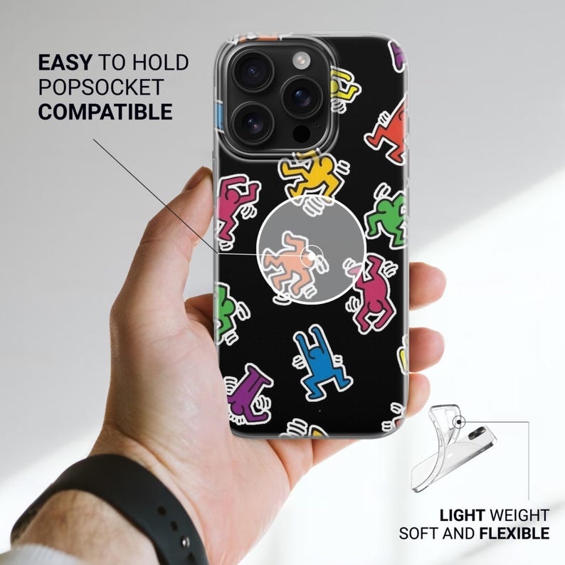 May include: Clear phone case with a black background and colorful dancing figures. The case is labeled "EASY TO HOLD POPSOCKET COMPATIBLE" and "LIGHT WEIGHT SOFT AND FLEXIBLE".