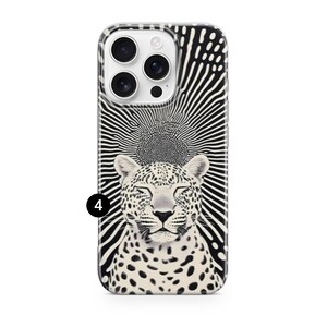 May include: A phone case featuring a black and white design. The case has a black and white leopard illustration with closed eyes, set against a radiating sunburst pattern. The case has a glossy finish.