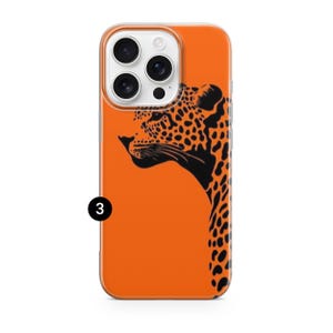 May include: Orange phone case with a black and orange leopard design. The case features a clear border and a graphic of a leopard's head and neck. The phone case is designed to fit a smartphone.