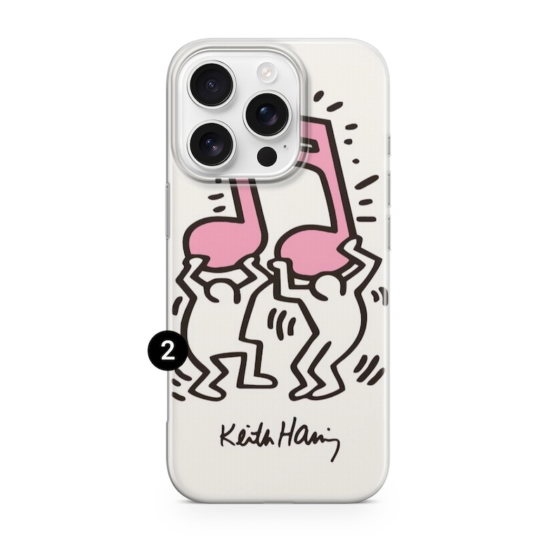 May include: A white iPhone case featuring a pink musical note design held by two stick figures. The case has a clear border and the artist's signature, "Keith Haring," is at the bottom.