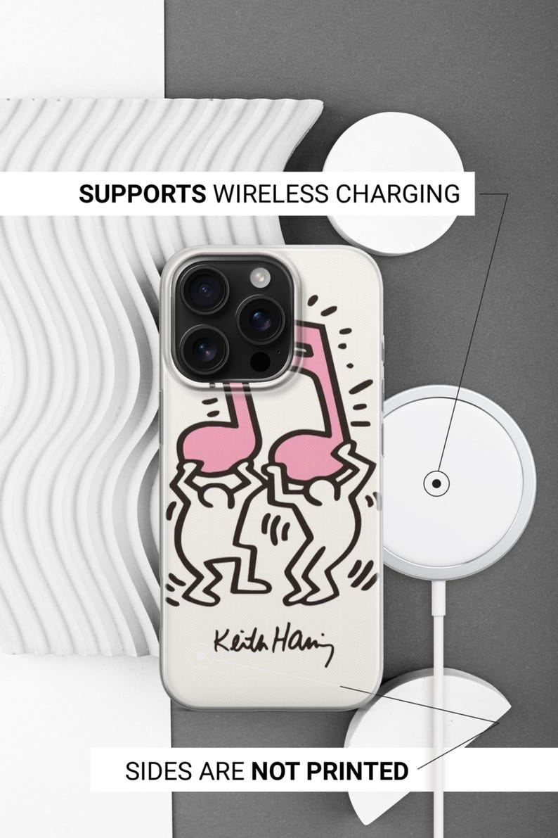 May include: A clear phone case featuring a Keith Haring design with a pink musical note and dancing figures. The case has a white background and the text "SUPPORTS WIRELESS CHARGING" and "SIDES ARE NOT PRINTED".