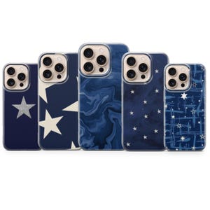 May include: Five navy blue phone cases with various designs. The cases feature a silver glitter star, white stars, a blue marble pattern, a starry night design, and a white star and line pattern. The cases are designed to fit a smartphone.