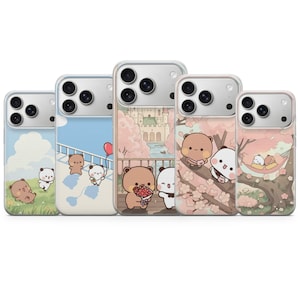 May include: Five phone cases with cute cartoon bear and panda designs. The cases feature various scenes, including a field, a bridge, a castle, a cherry blossom tree, and a hammock. Each case has a clear border and a camera cutout.