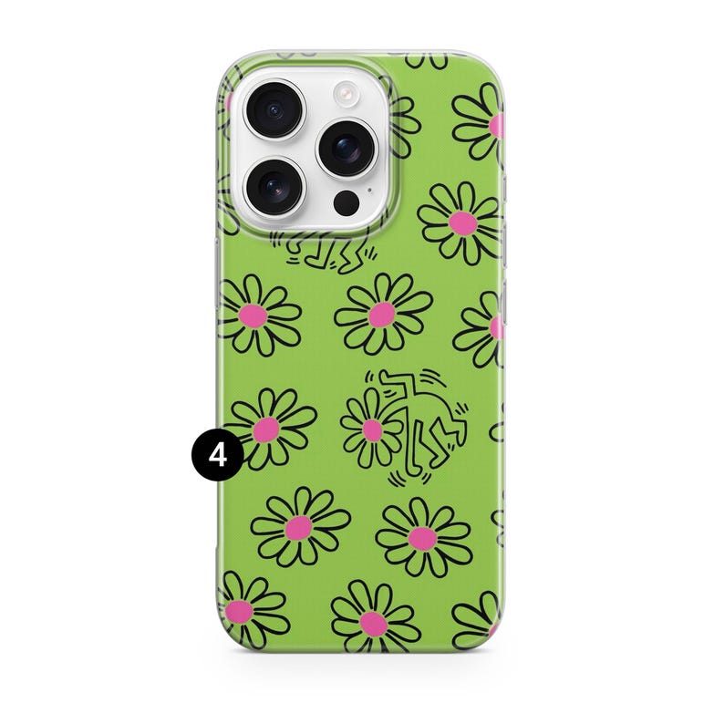 May include: A green phone case featuring a repeating pattern of black outlined daisies with pink centers. The case also includes a Keith Haring-inspired figure. The phone case has a clear border and a camera cutout.