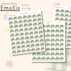 Può includere: Tre fogli di adesivi con emoticon di rane verdi con varie espressioni. I fogli sono etichettati come "Angry Herbert Emoti", "Sad Herbert Emoti" e "Happy Herbert Emoti". È visibile anche il testo "Lily pad plans" e "Emotis the Frog".