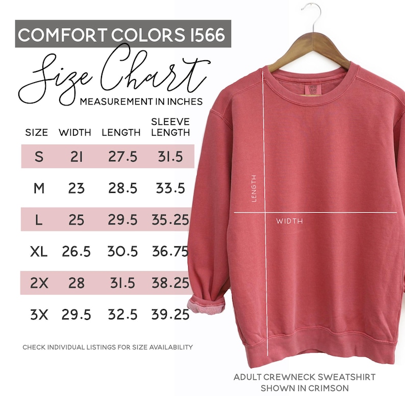 May include: Crimson adult crewneck sweatshirt on a wooden hanger. The image includes a size chart with measurements in inches for width, length, and sleeve length. The size chart is for Comfort Colors 1566 sweatshirts.