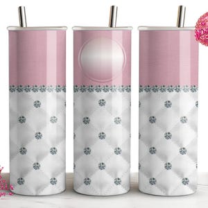 May include: Three cylindrical tumblers with silver straws. The top section is solid light pink, while the bottom features a white quilted pattern with silver diamond accents at each intersection. A circular blank space is on the center tumbler.