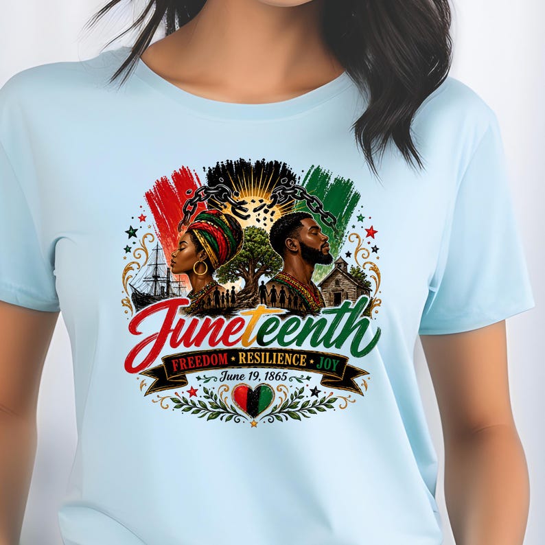 May include: Light blue t-shirt featuring a colorful graphic celebrating Juneteenth. The design includes silhouettes of a man and woman, a tree, and the text "Juneteenth" in red script. Additional text reads "Freedom, Resilience, Joy" and "June 19, 1865."