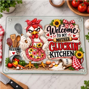 May include: A rectangular glass cutting board featuring a cartoon chicken wearing a red gingham headband and apron with sunflowers. The text reads Welcome to my mother gluckin' kitchen. Includes illustrations of kitchen tools, vegetables, and flour.