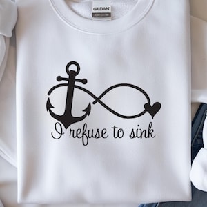 May include: White sweatshirt with a black anchor and infinity symbol design. The phrase "I refuse to sink" is written below the graphic. The sweatshirt has a crew neck and long sleeves.