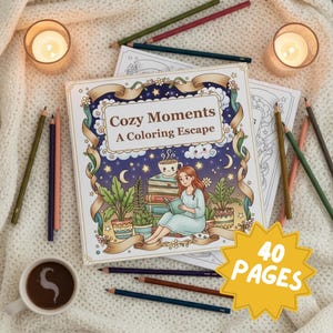 A cozy flat lay of the adult coloring book Cozy Moments: A Coloring Escape, displayed on a soft knitted cream blanket. The illustrated cover shows a red-haired woman in pajamas sitting peacefully with plants, books, and a cat under a dreamy starry night sky. Around the book are colored pencils, a cup of coffee with heart-shaped foam art, and glowing candles, creating a relaxing and inviting atmosphere. A bright yellow starburst label highlights “40 Pages,” emphasizing the content of the book.