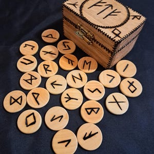 Viking runes in a wooden box.