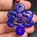 Hand-Carved Lapis Lazuli Endless Knot Pendant, AAA Grade Afghan Gemstone product logo