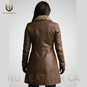 May include: A brown leather coat with a faux fur collar. The coat has a tailored fit and long sleeves. The back view shows the coat's design, including seams and a button closure. The logo "HU LEATHER CA" is visible.