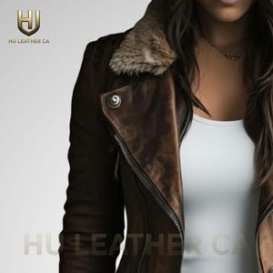 May include: A brown leather jacket with a fur collar and a zipper closure. The jacket has a distressed look and the text "HU LEATHER CA" is visible.