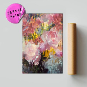 May include: A canvas print featuring a floral abstract painting with pink, yellow, and white flowers. The print has a sticker that says "CANVAS PRINT". A rolled-up poster is next to the print.