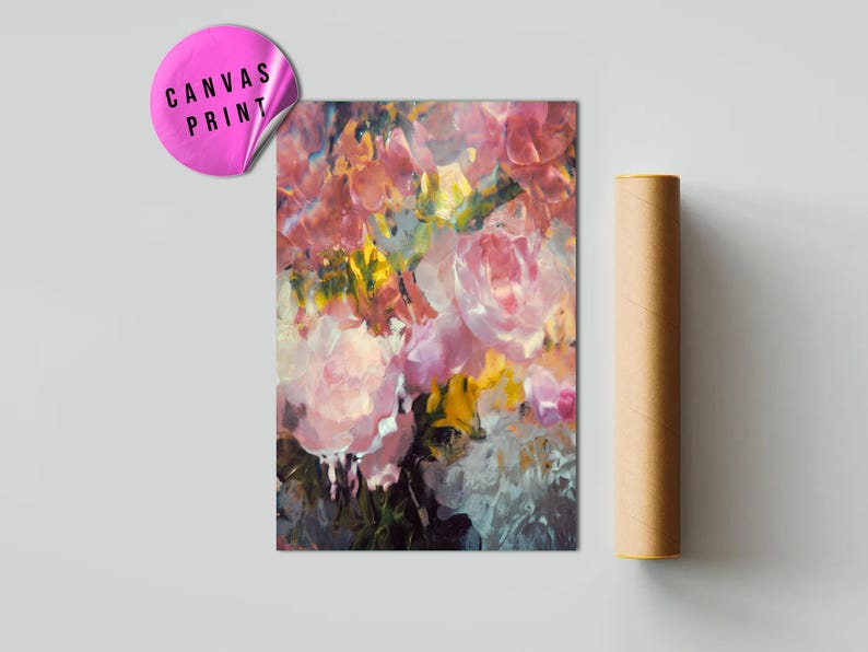 May include: A canvas print featuring a floral abstract painting with pink, yellow, and white flowers. The print has a sticker that says "CANVAS PRINT". A rolled-up poster is next to the print.