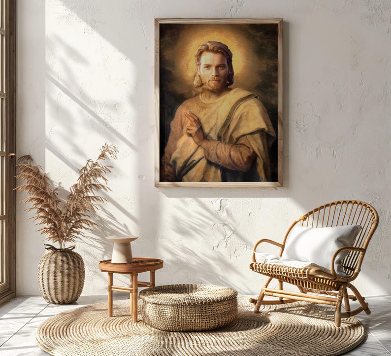 May include: A framed portrait of a man with long hair and a halo, dressed in light-colored robes. The artwork has a vintage, painterly style. The image is displayed on a white wall, with a wooden frame.