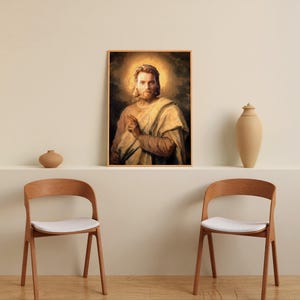 May include: A framed portrait of a man with a halo, dressed in light-colored robes, hangs above a shelf. Two wooden chairs with white seats are in front of the shelf. Decorative vases are on the shelf.