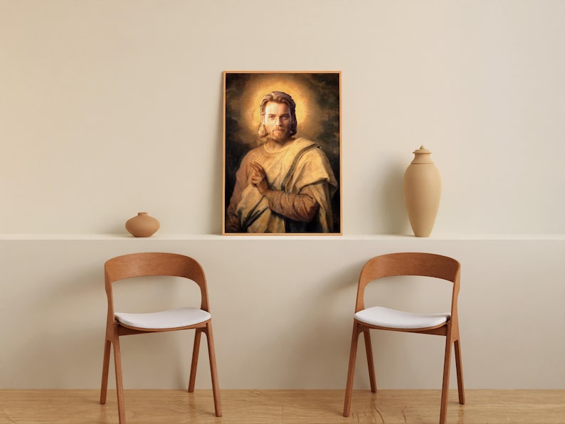 May include: A framed portrait of a man with a halo, dressed in light-colored robes, hangs above a shelf. Two wooden chairs with white seats are in front of the shelf. Decorative vases are on the shelf.