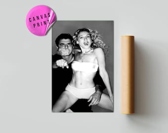 May include: Black and white canvas print featuring a photograph of a man and a woman. The woman is wearing a white top and underwear. The man is wearing a black shirt. A pink sticker with the words "CANVAS PRINT" is in the upper left corner.