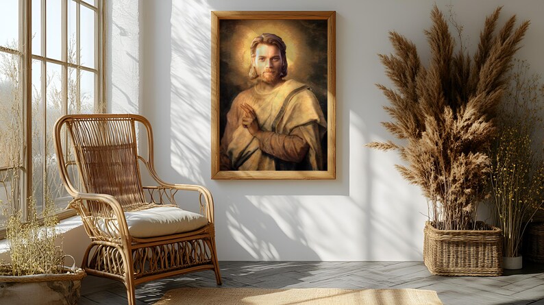 May include: A framed portrait of a man with a halo, in a light-colored robe, hangs on a white wall. A wicker chair with a cream-colored cushion sits to the left. A large arrangement of dried plants in a woven basket is to the right.