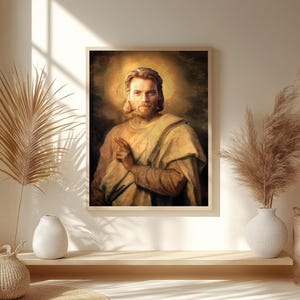 May include: A framed portrait of a man with long hair and a beard, wearing a light-colored robe. The portrait has a golden halo around the man's head. The artwork is displayed on a wall with decorative elements.