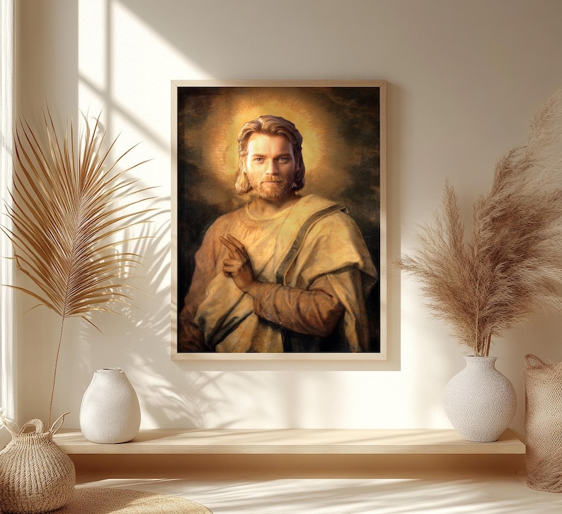 May include: A framed portrait of a man with long hair and a beard, wearing a light-colored robe. The portrait has a golden halo around the man's head. The artwork is displayed on a wall with decorative elements.