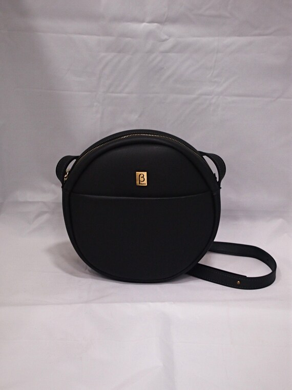 round black leather crossbody bag
