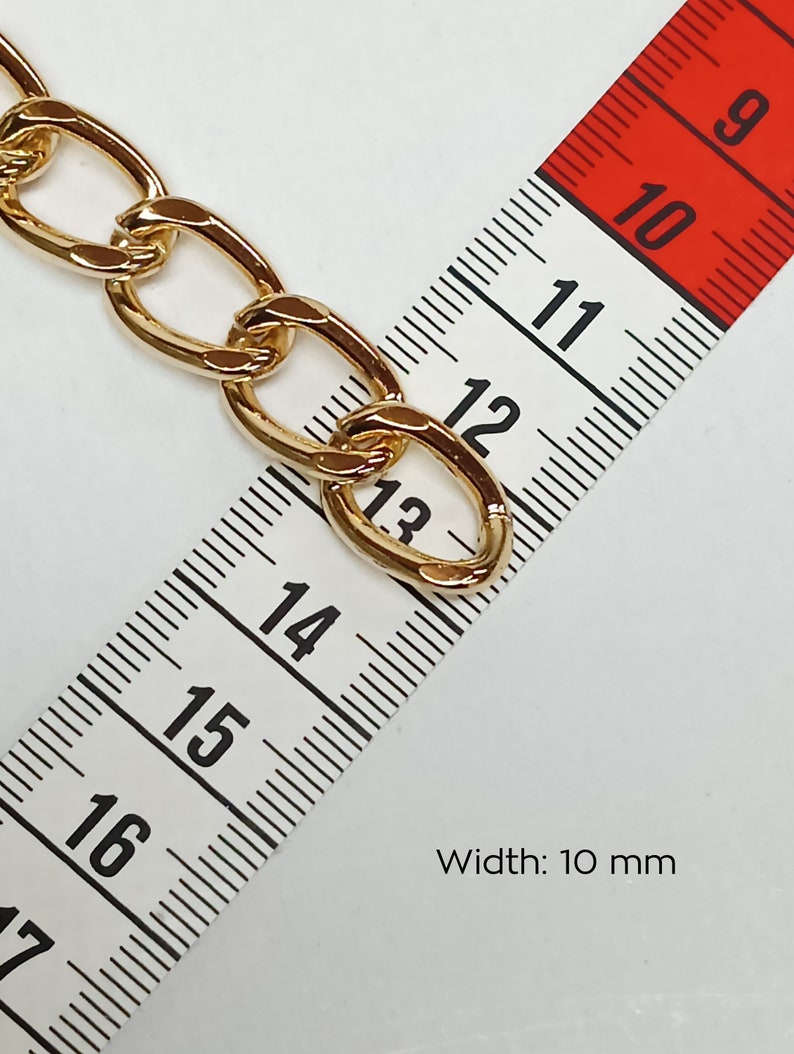 May include: Gold chain link with a width of 10 mm, measured with a tape measure.