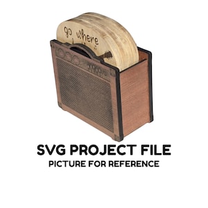 May include: Wooden coaster set with a guitar amplifier-shaped holder. The coasters are round, light-colored wood with the words "go where" and a guitar silhouette. The holder is brown with a speaker grill design and the text "SVG PROJECT FILE PICTURE FOR REFERENCE".